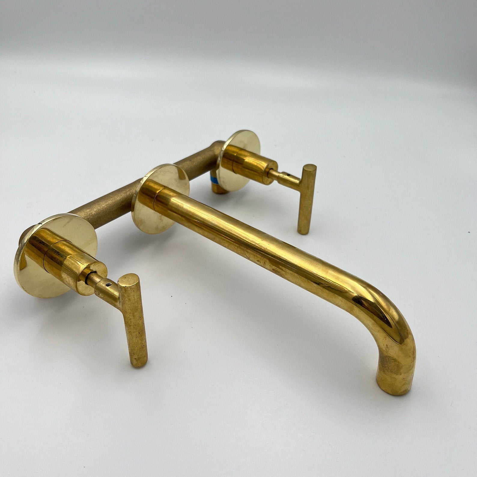 Unlacquered Brass Wall Mount Bathroom Faucet With Lever Handles