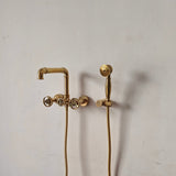 brass wall mount tub faucet with handles