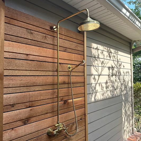 unlacquered brass shower system with hendshower