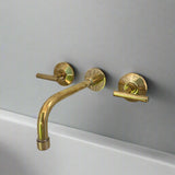 unlacquered brass bathroom faucet