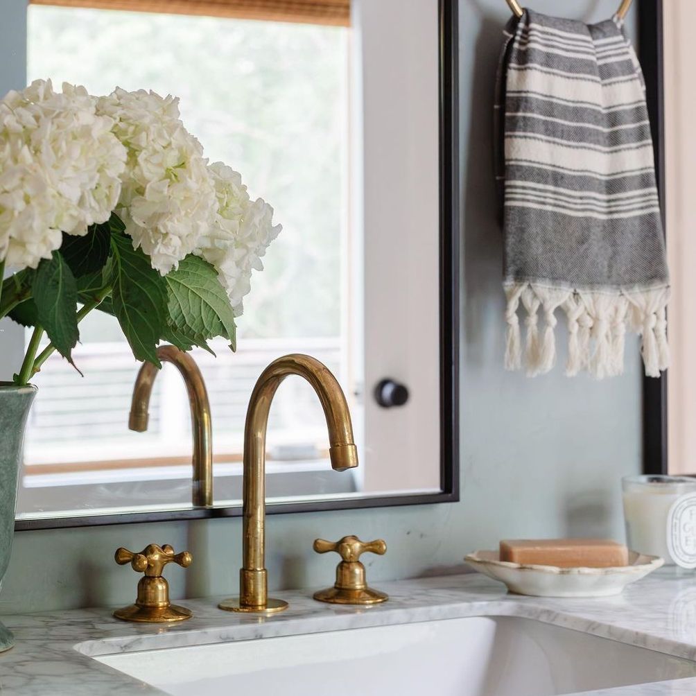 Unlacquered brass bathroom faucet with vintage handles - oldenglow.com
