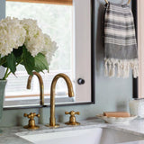 Unlacquered brass bathroom faucet with vintage handles - oldenglow.com