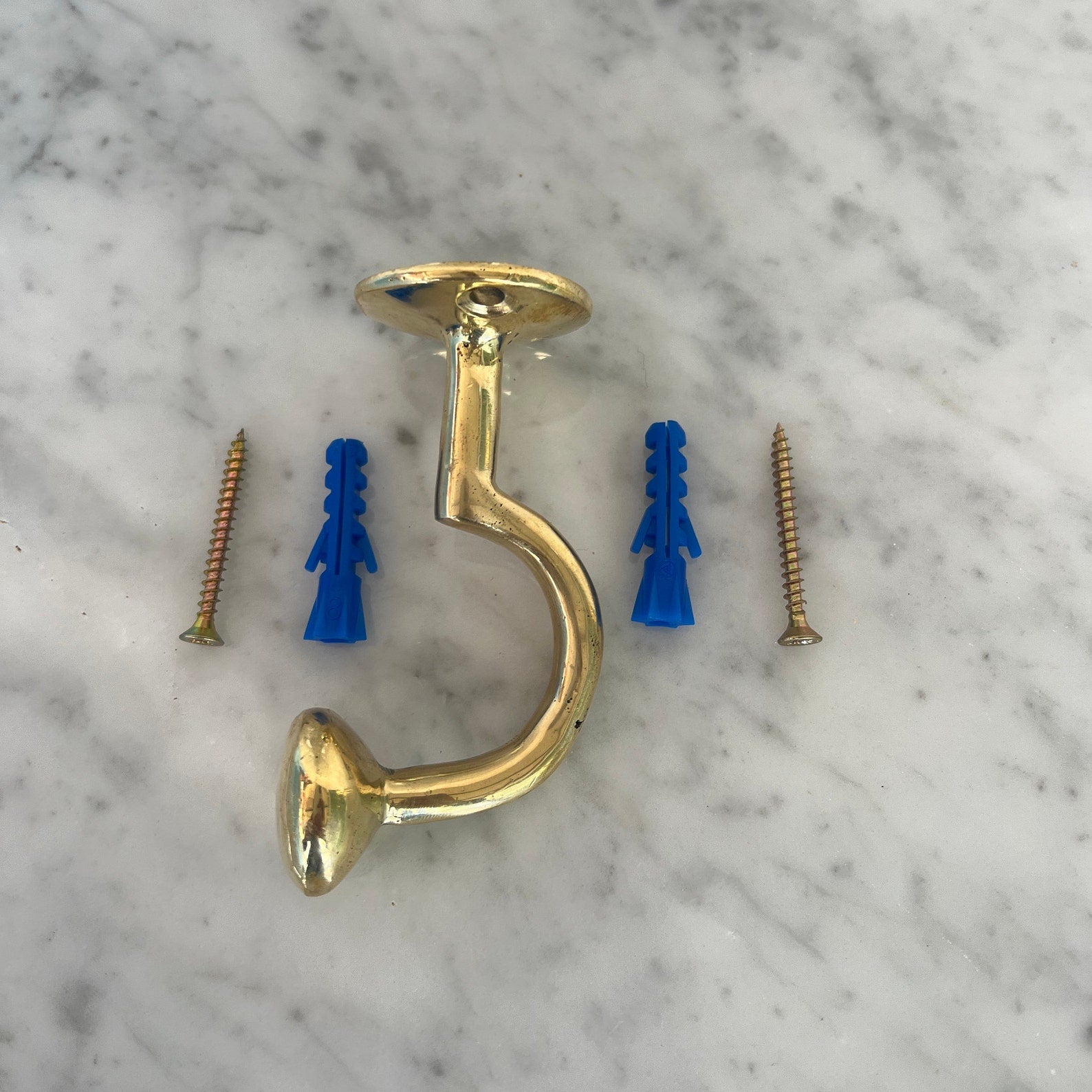 unlacquered brass clothes hooks