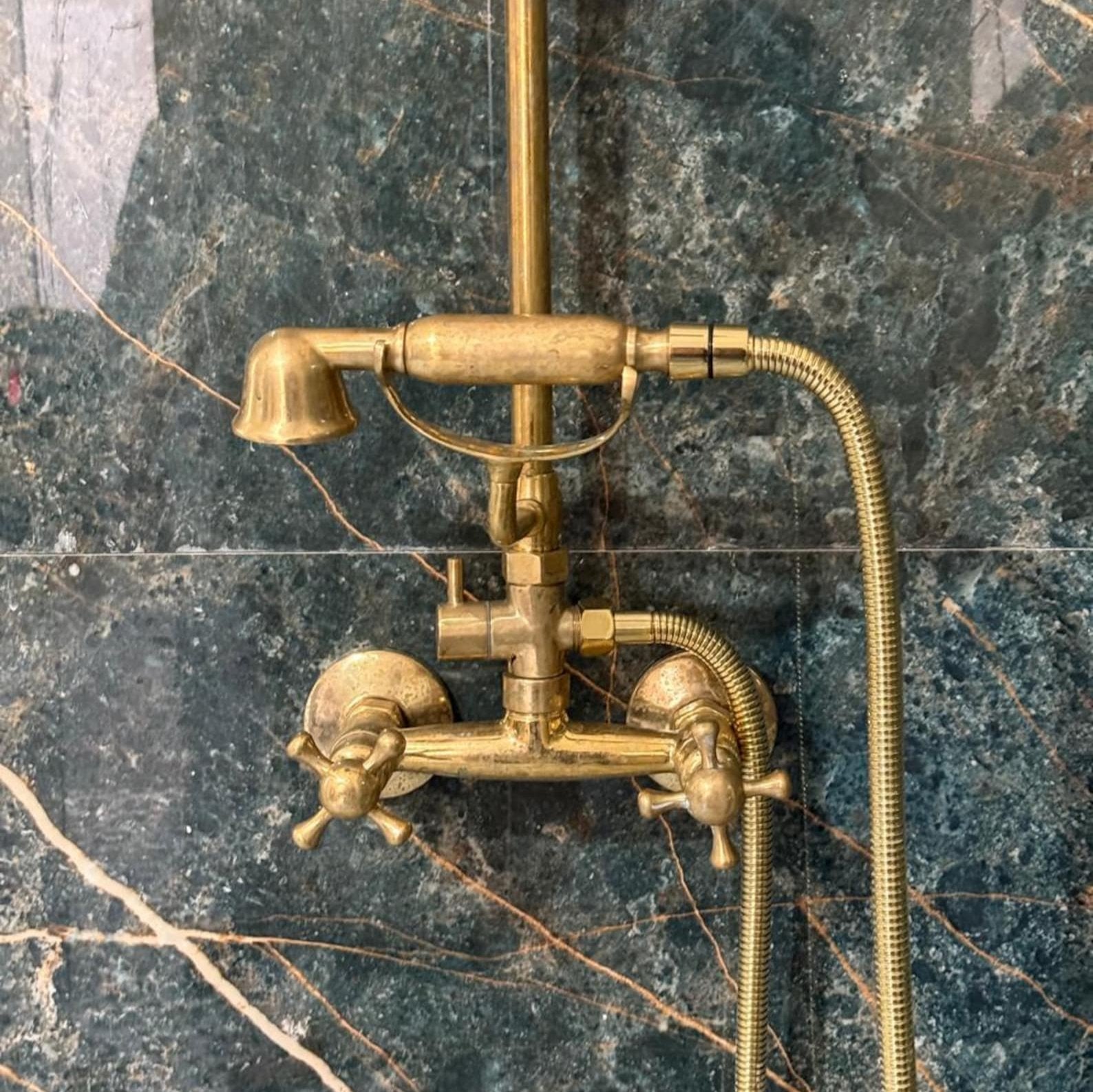 unlacquered brass exposed shower system with handheld
