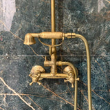 unlacquered brass exposed shower system with handheld