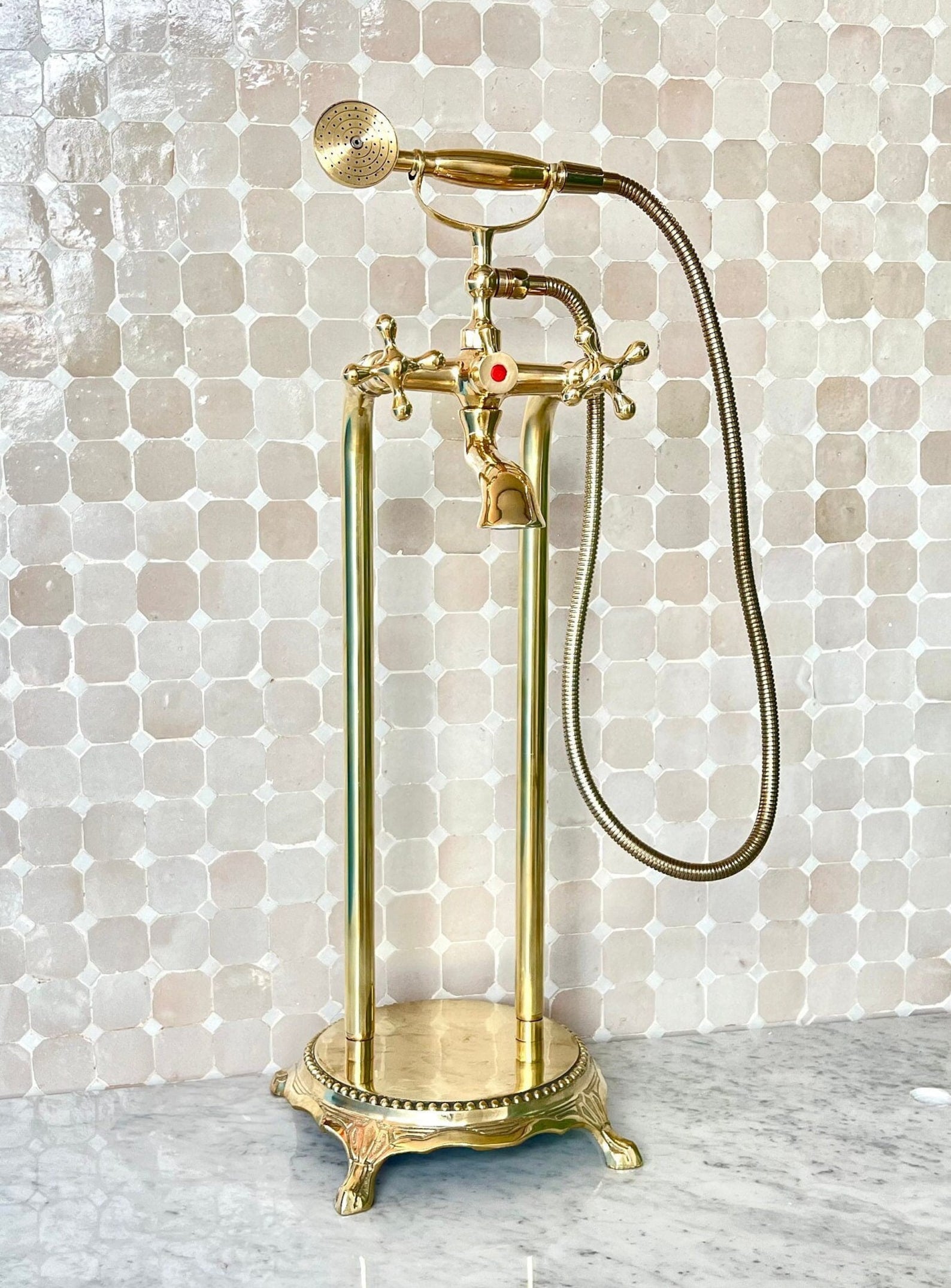 unlacquered brass freestanding tub filler with handheld and handshower