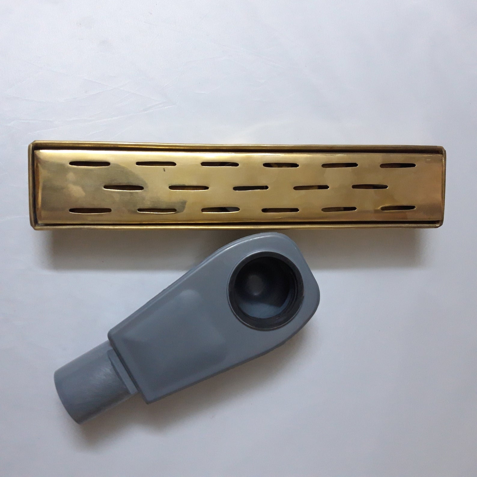 unlacquered brass linear floor drain