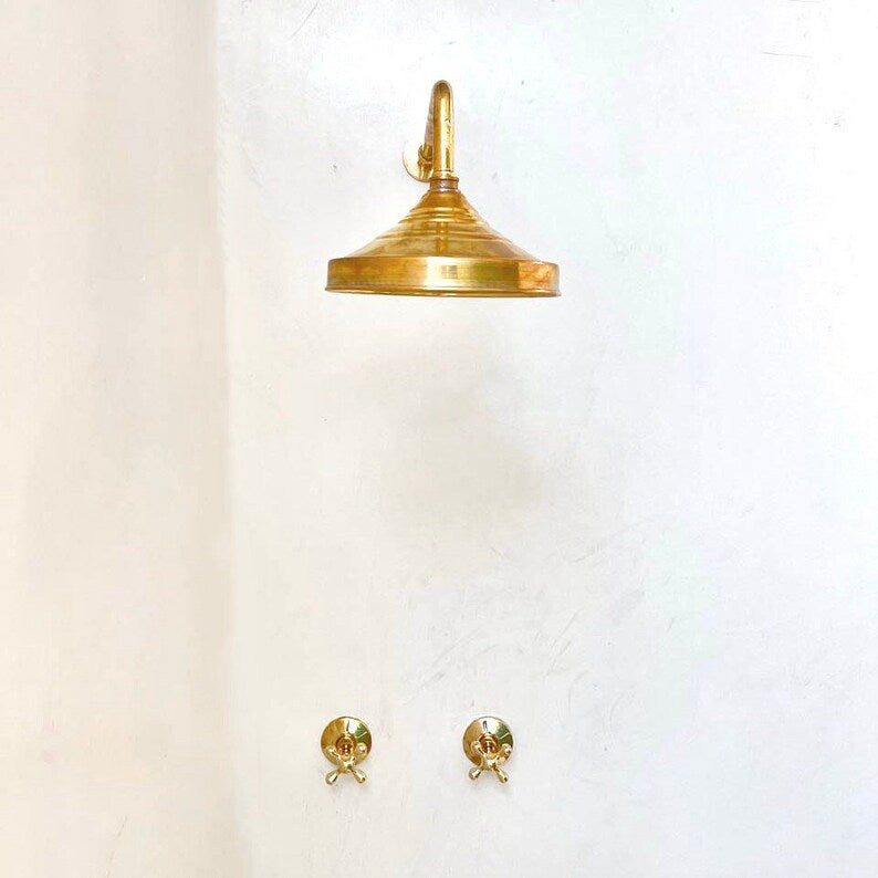 unlacquered brass shower head with two handles