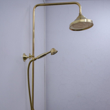 unlacquered brass shower system with handheld