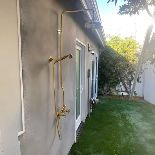 unlacquered brass shower system with handheld