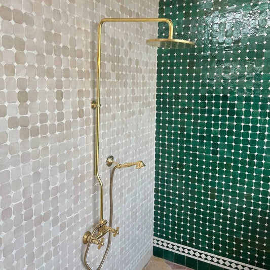 unlacquered brass shower system with showerhand