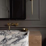 Oldenglow.com | unlacquered brass wall mounted faucet