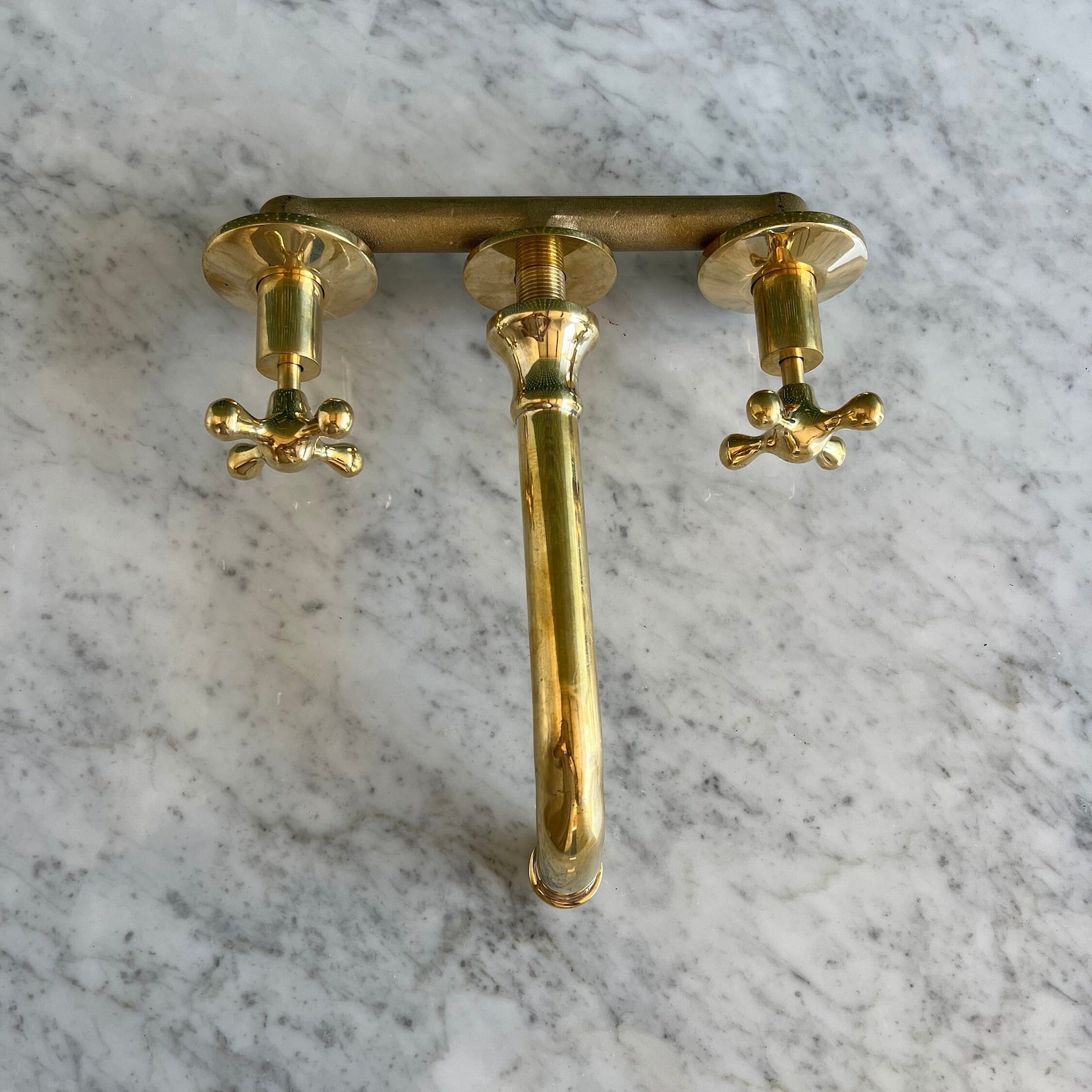 unlacquered brass wall mounted faucet with valve