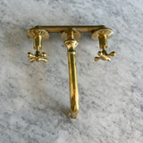 unlacquered brass wall mounted faucet with valve