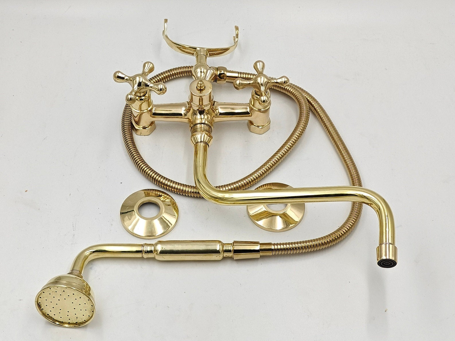 unlacquered brass wall mounted tub filler