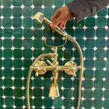 unlacquered brass wall tub faucet with shower hand