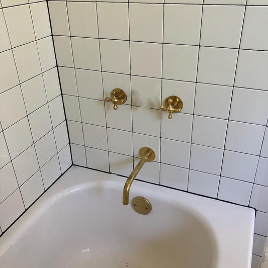 unlacquered brass bathtub faucet