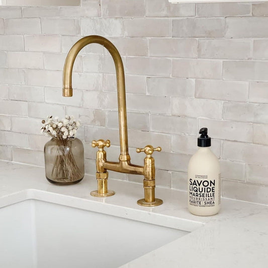 Why We Chose Unlacquered Brass Faucets (And Why They Make the Kitchen Feel Alive)
