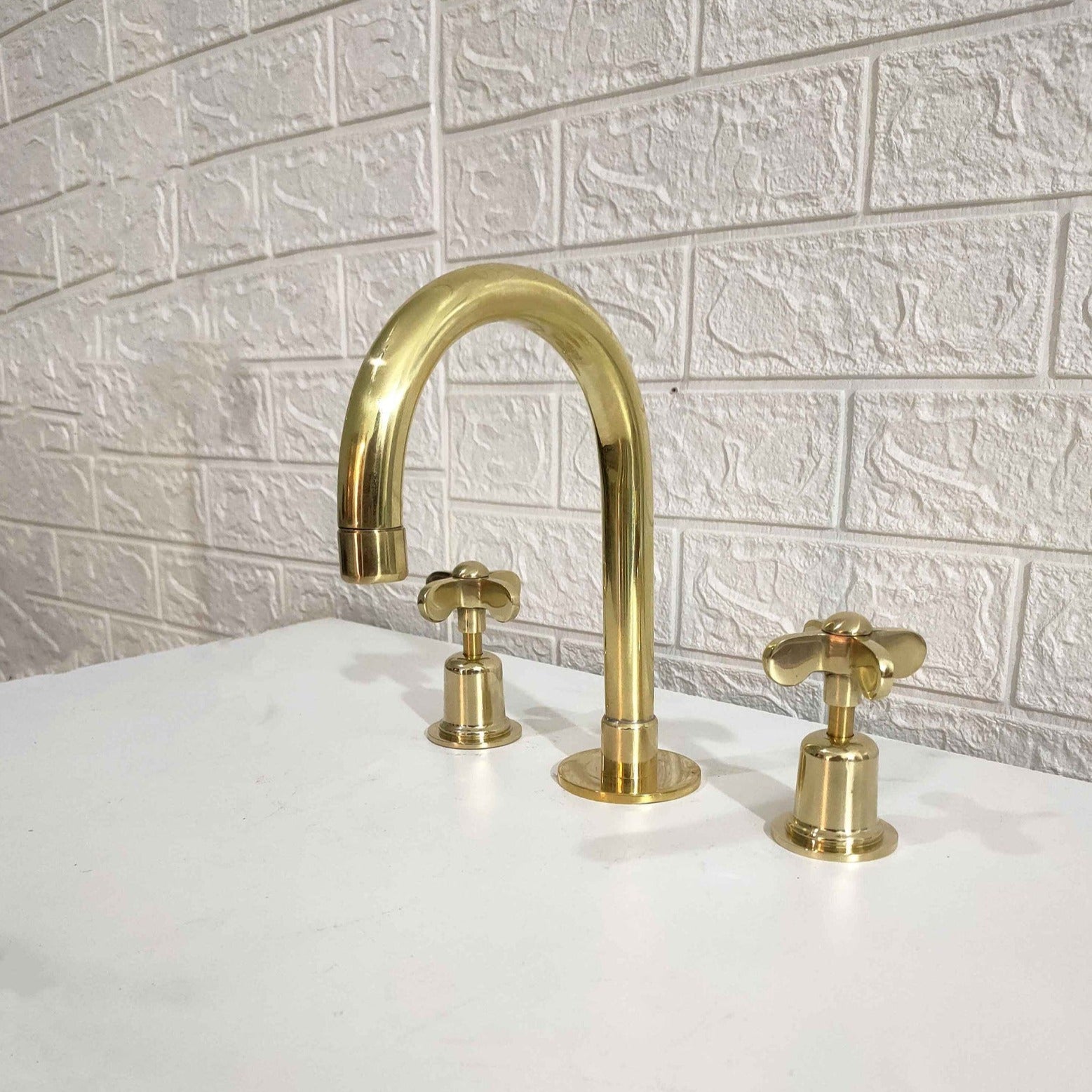 Unlacquered brass bathroom faucet 