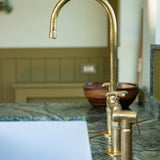 unlacquered brass bridge kitchen faucet