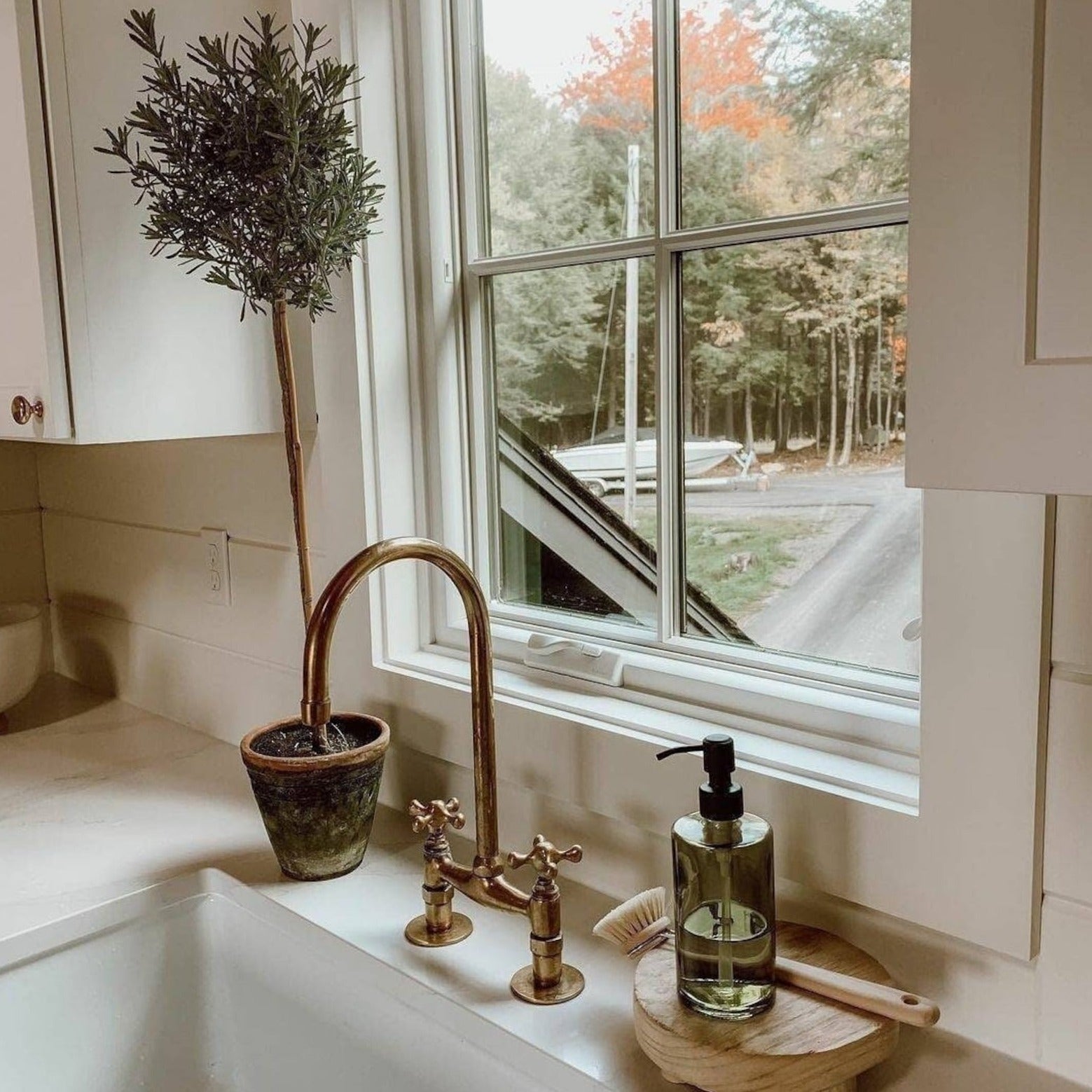 unlacquered brass bridge kitchen faucet