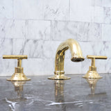 unlacquered brass bathroom faucet with lever handles 