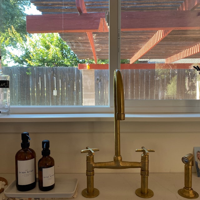 unlacquered brass  bridge kitchen faucet with sprayer
